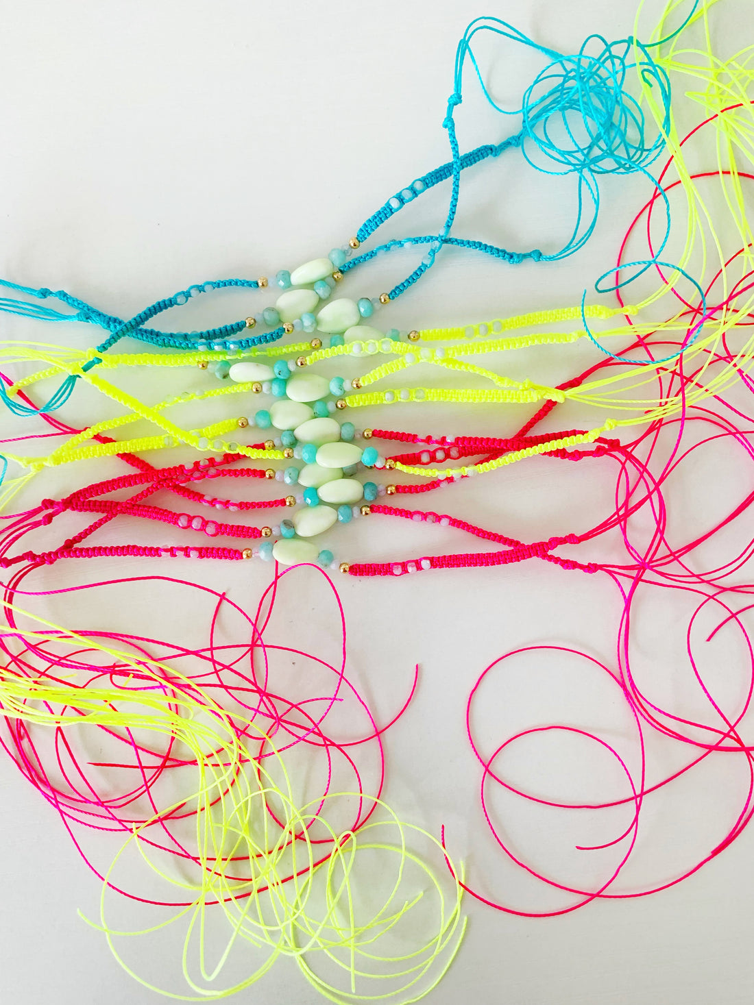 Coastal Bracelets for the Cape Cod Gift Show. Macramé jewelry in neon colors that are beach inspired by mermaids and madeleines