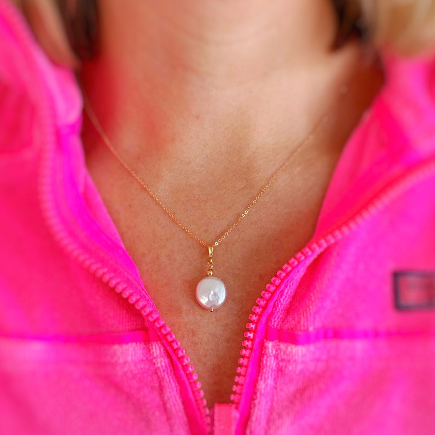 cover for the mermaids and madeleines tide pool collection pictures a person wearing the barrington and raindrop aqumarine necklace wearing a yellow striped shirt