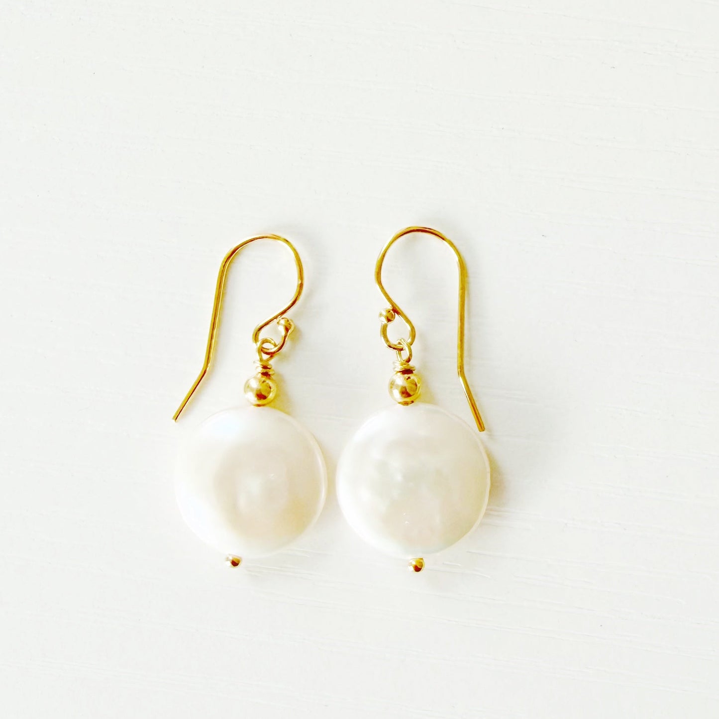 Pair of pearl earrings on a white background