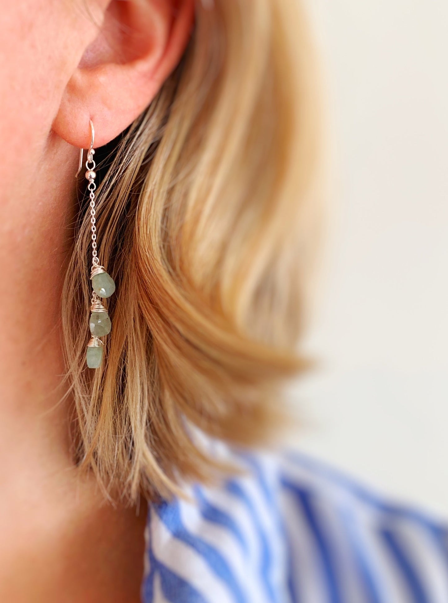 This is an image of a person wearing the raindrop earring to show wearability