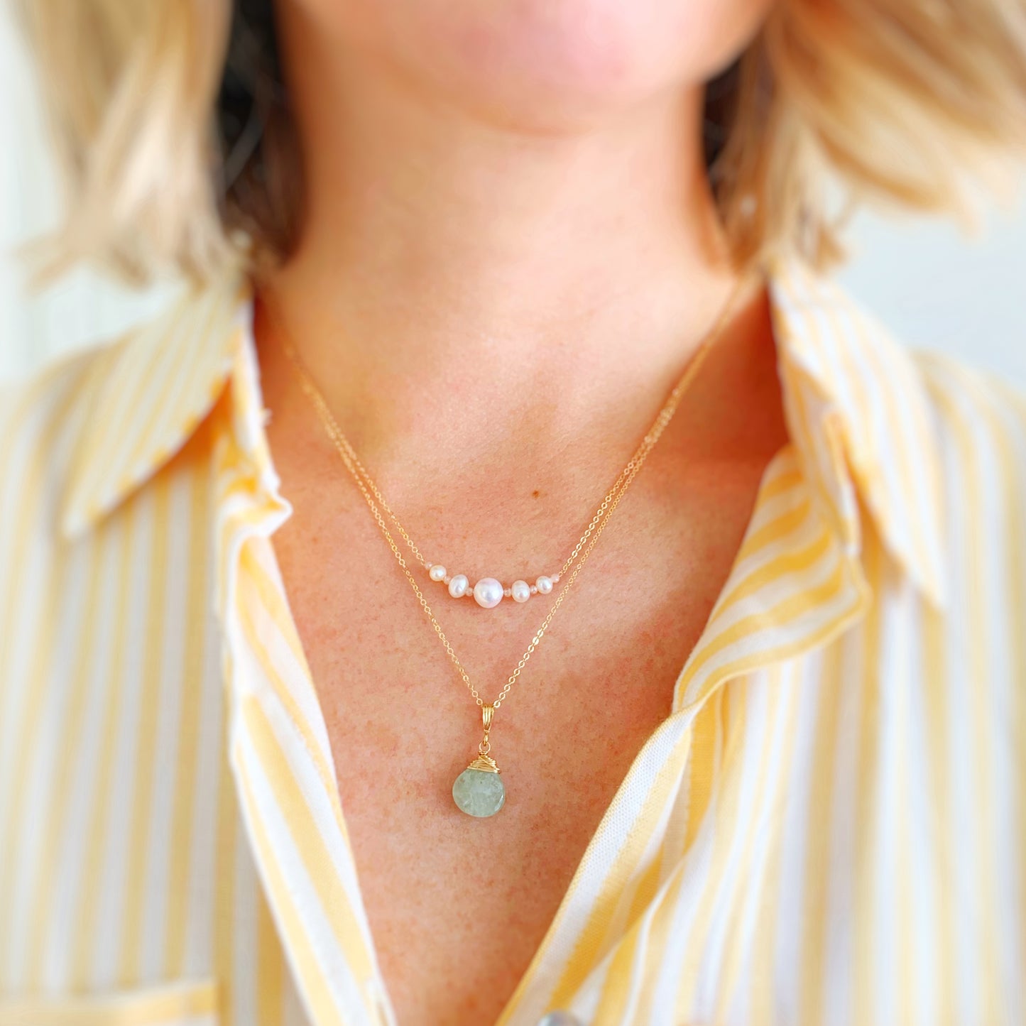 an image of a person wearing the barrington necklace at 17" and the raindrop necklace drop pendant to show wearability