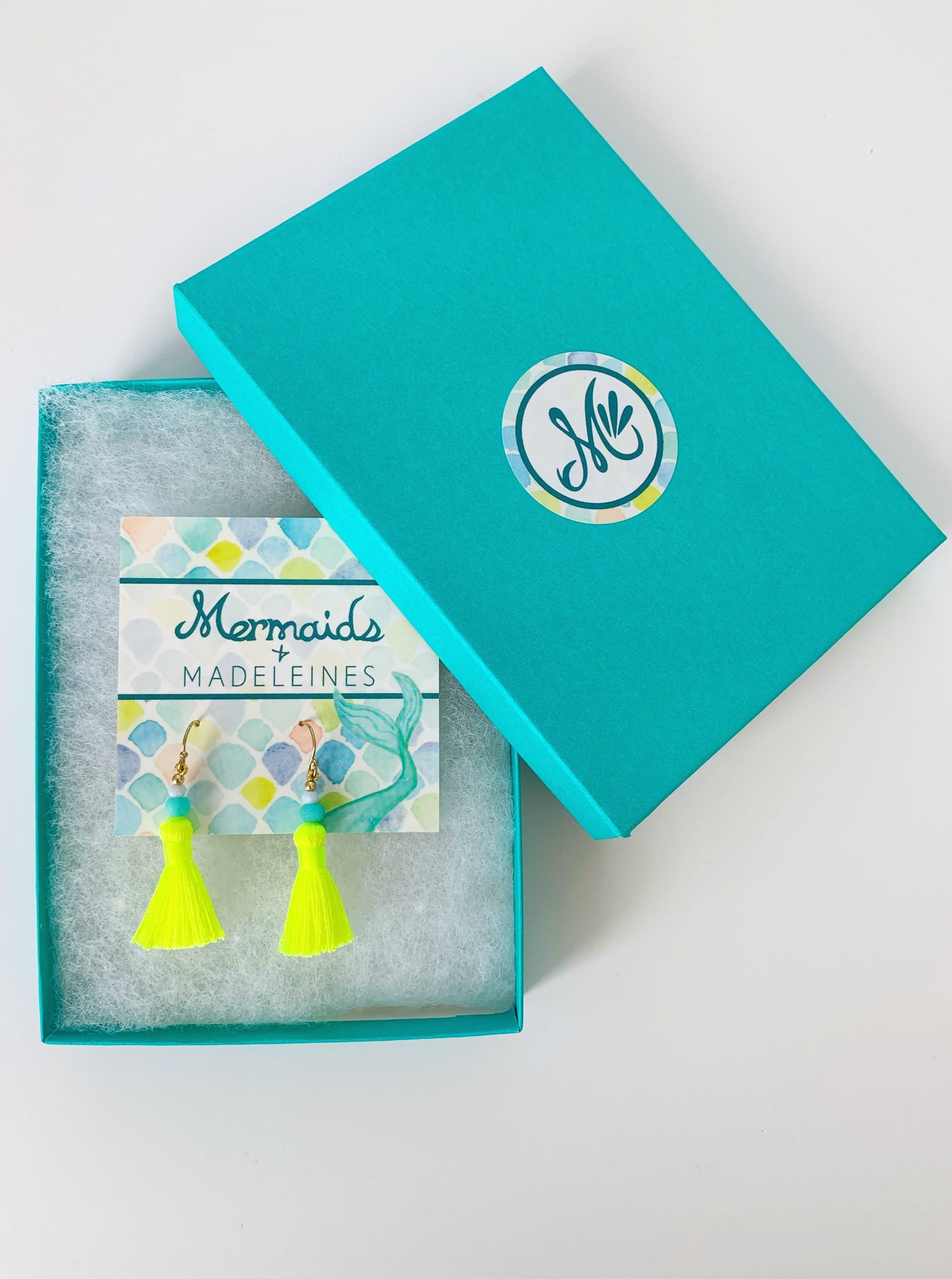 Captiva Tassel EArrings, neon yellow with semiprecious gems and 14k gold filled. This pair is photographed in a teal gift box on a white surface