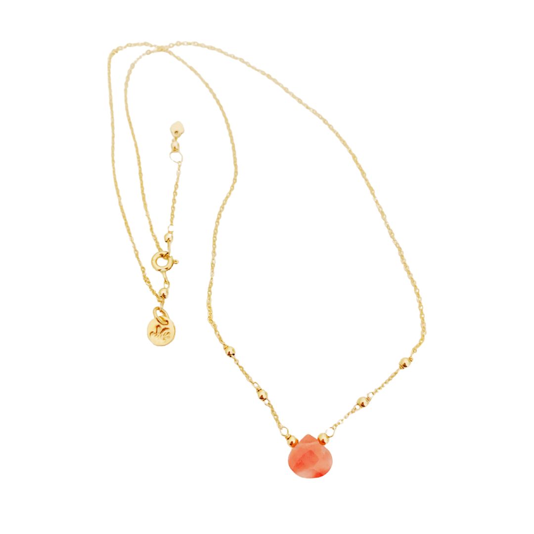 Chatham Necklace by Mermaids and Madeleines features a cherry quartz briolette drop and 14k gold filled beads, findings and chain. This is a photograph of the full length of the necklace on a white background